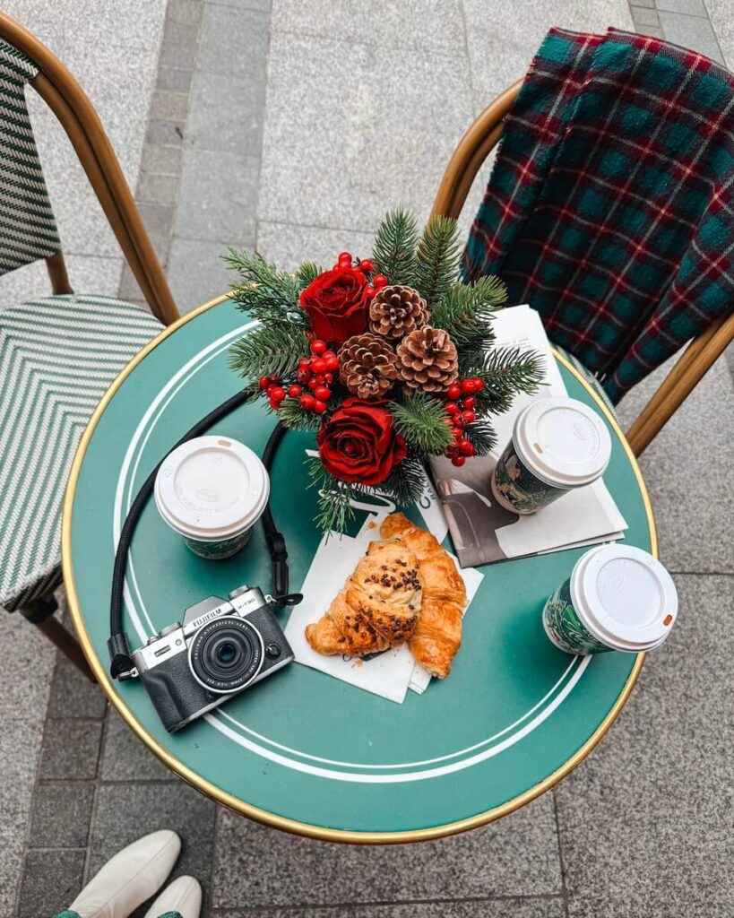 table with croissant and coffee at ralph's coffeeshop in London