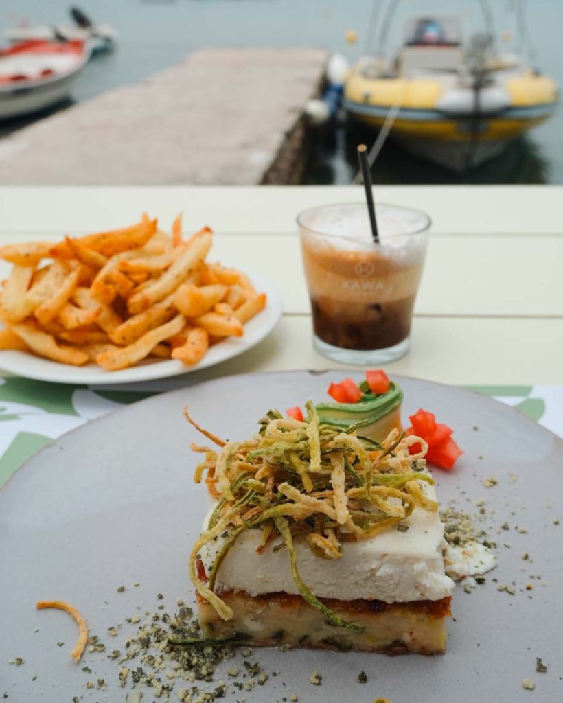 food in front of beach view at Yialos in Pollonia