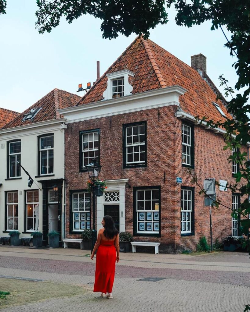 jackie looking out at a brick building in naarden
