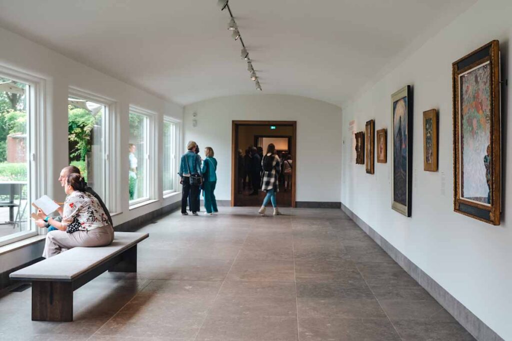 people browsing an art gallery at Singer Laren museum one of the best things to do outside of Amsterdam