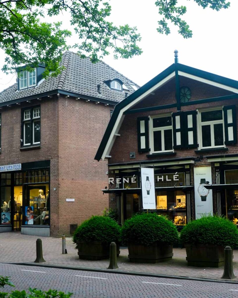 a brick building with a shopfront in laren a beautiful town in the Netherlands