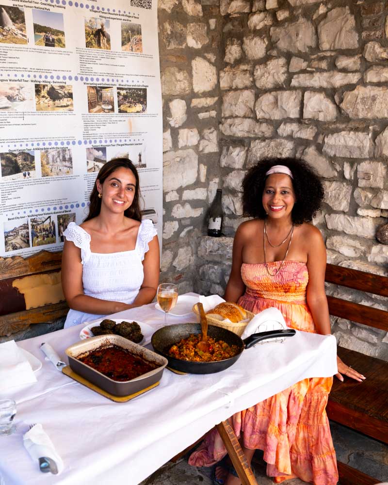 females sitting at a table enjoying their meal after a cooking class at berat castle