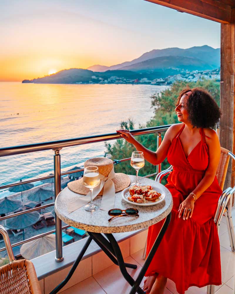 hotel with a balcony view of sunset at potam beach himare albania