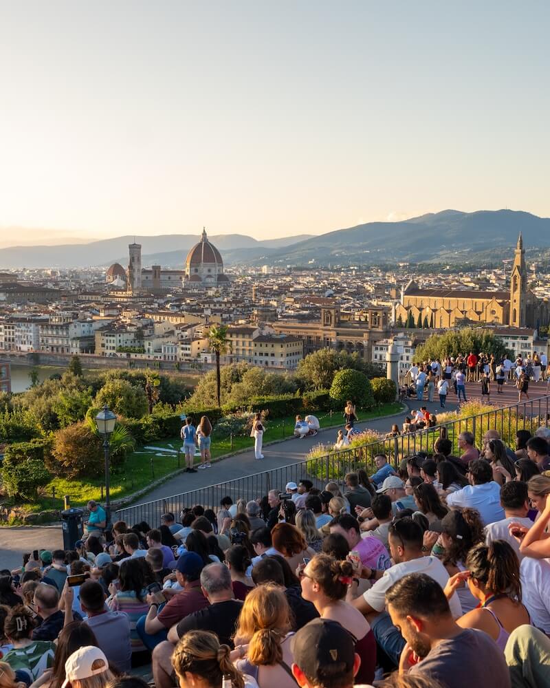 crowds sitting on stairs to watch the Sunset at Piazzale Michelangelo