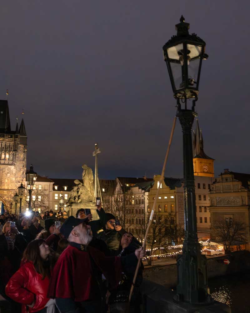  Lamplighter on Charles Bridge best things to do at christmas in prague