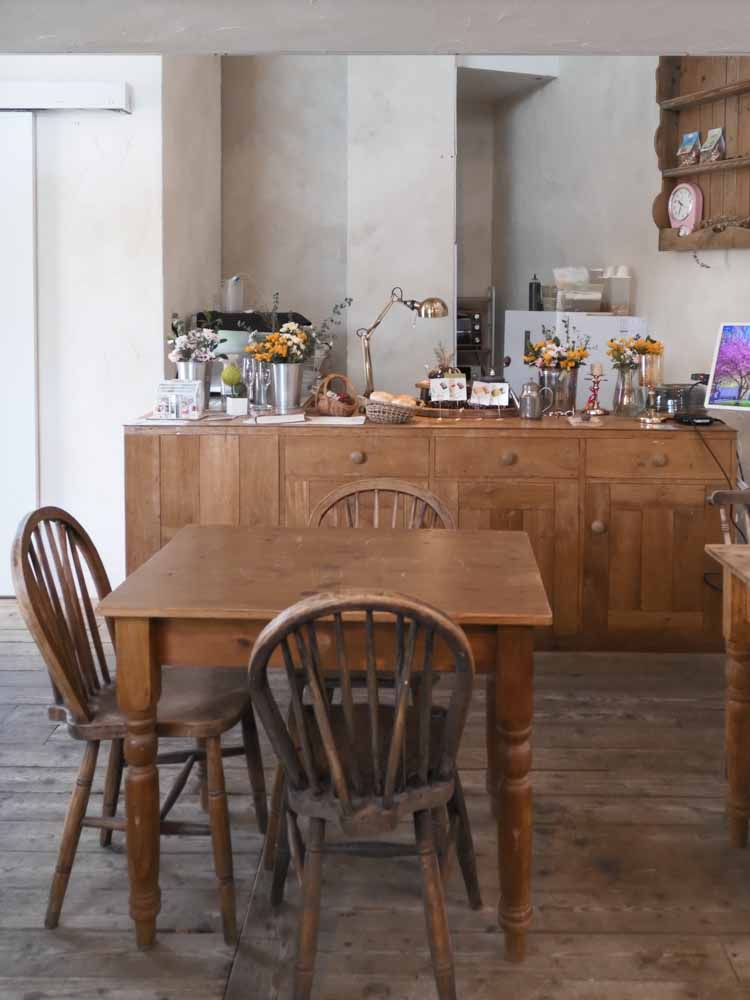 Cozy wooden cafe interior with flowers