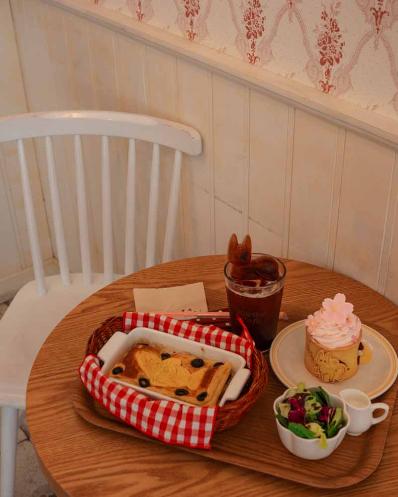Dessert and drink on wooden table at Koriko Cafe in Seo0ul