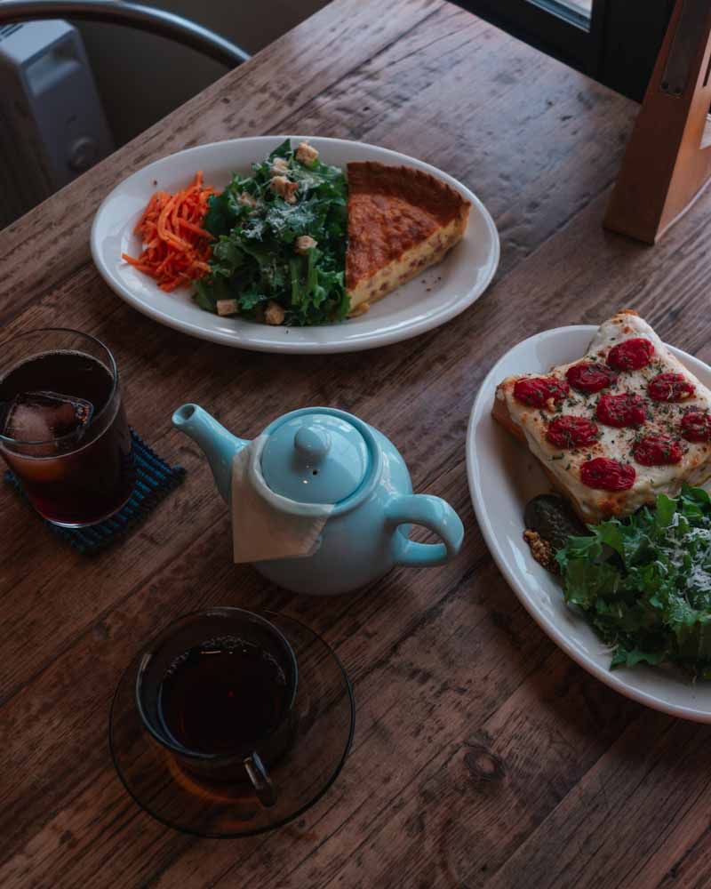 food and tea on a table at a cafe called l’ Atelier Le Pli